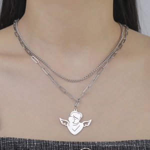 Detailed view of silver layered paperclip chain necklace with angel mother child pendant