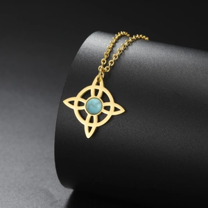 Close-up of golden Celtic knot necklace pendant featuring a blue marble turquoise stone