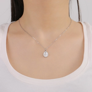 Minimalist stainless steel oval saint icon pendant necklace on silver cross chain for women
