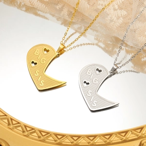 Matching heart puzzle necklaces with Big Sis engraving in gold and silver finish