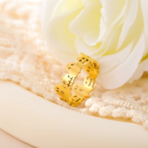 Detailed macro shot of gold hollow ghost ring with festive Halloween design