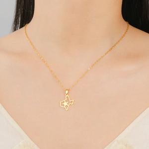 Detail shot of a gold Texas map pendant with hollow star on a 304 stainless steel chain