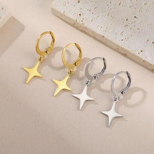 Detailed view of polished stainless steel star pendant hoop earrings in gold and silver
