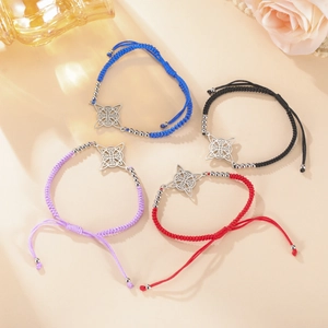 Detail of colorful braided rope bracelets with Celtic knot stainless steel charms