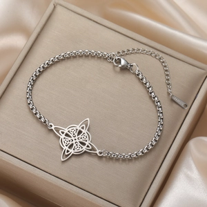 Macro view of stainless steel Celtic knot bracelet charm with lobster clasp and chain link