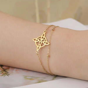 Double-layer gold stainless steel bracelet with cutout geometric charm and metal beads