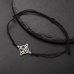 Minimalist black rope bracelet with silver stainless steel Celtic knot charm on stone