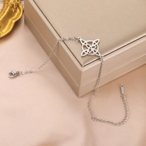 Silver stainless steel bracelet with cutout witchcraft knot detail and lobster clasp closure