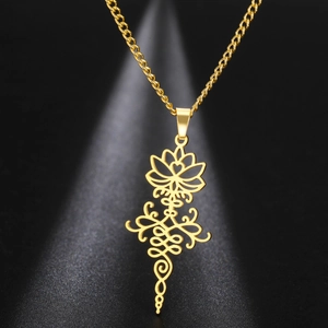 Close-up of golden hollow lotus pendant with complex textures on stainless steel necklace