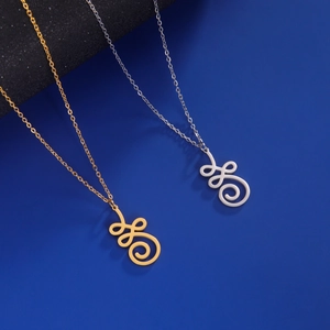 Detailed view of hollow lotus pendants in gold and silver finish with spiral design