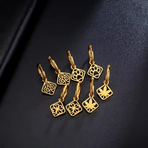 Golden stainless steel jewelry set featuring square pendants with diverse patterns