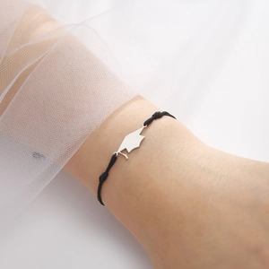 Adjustable black cord graduation bracelet with a polished silver stainless steel mortarboard charm