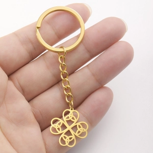 Polished gold stainless steel four leaf clover keychain with classic Celtic knot design