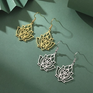 Detailed close-up of hollow lotus flower dangle earrings in gold and silver steel finish