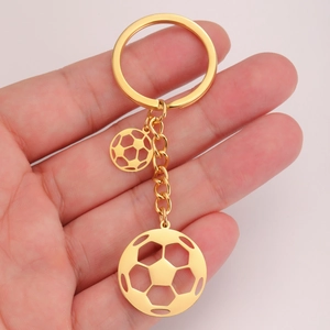 Polished gold stainless steel soccer ball keychain with dual hollow football charms