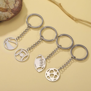 Detailed set of silver stainless steel sports keychains featuring hollowed-out ball charms
