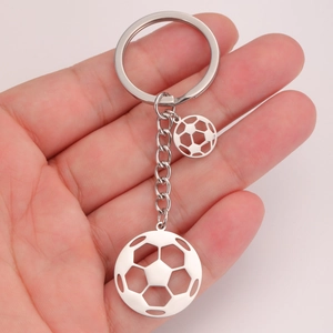 Detail shot of hollowed-out soccer pendants on a durable stainless steel keychain