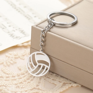 Polished stainless steel volleyball keychain with hollow cut design on jewelry box