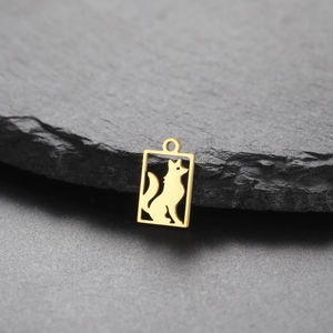 Detailed close-up of a gold stainless steel rectangle pendant with fox silhouette cutout