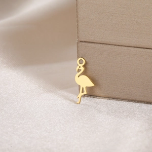 Macro view of gold flamingo charm in stainless steel with a polished finish for DIY jewelry