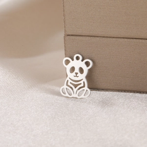 Detailed view of a silver panda-shaped stainless steel pendant with hollow design for necklaces