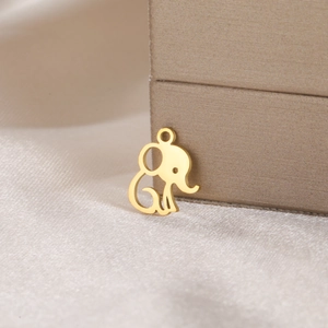 Detailed view of a golden elephant charm pendant with minimalist hollow outline design