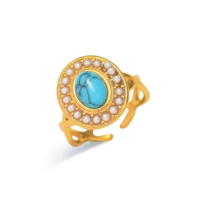 Anillo abierto vintage dorado con piedra turquesa ovalada y halo de perlas en blanco