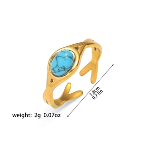 Detalle del anillo dorado turquesa mostrando un peso de 2g y un diámetro de 1,8cm