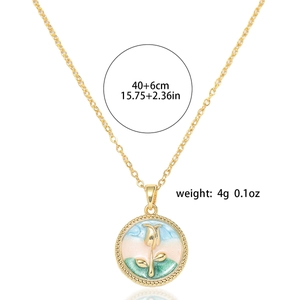 Detail of freshwater pearl necklace with floral enamel pendant and size specifications