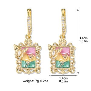 Detailed view of vintage gold frame earrings with rose motifs and product dimensions