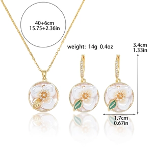Detail view of freshwater pearl floral necklace and earrings set with size measurements