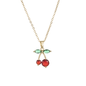Elegant cherry pendant necklace with red crystals and green leaves on a thin gold chain