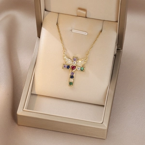 Golden cross necklace with angel wings and colorful zircons in a premium jewelry box
