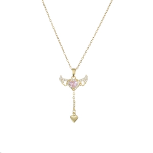 Macro shot of gold angel wing necklace featuring a pink heart gem and tassel charm