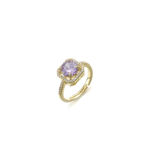 Macro shot of gold-plated ring showing detailed four-prong set purple zircon halo