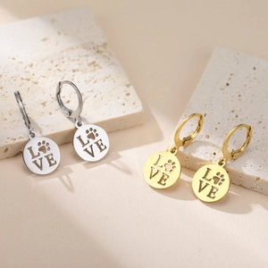 Stainless steel cutout paw print LOVE charm earrings in silver and gold finishes