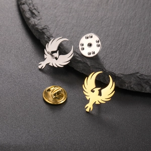 Detailed view of phoenix lapel pins in gold and silver finish with metal butterfly clasps