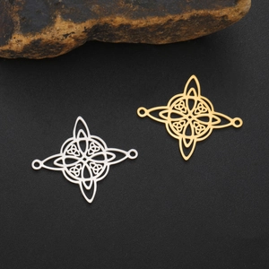 Close-up of gold and silver plated stainless steel Celtic Witch's Knot jewelry connectors