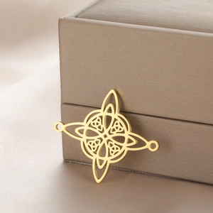 Macro shot of polished 18k gold plated stainless steel Celtic knot pendant for jewelry
