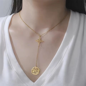 Golden stainless steel Y-shaped necklace featuring hollow star pendants on a model