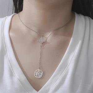 Close-up of stainless steel Y-necklace featuring Wiccan knot and engraved pentagram pendant