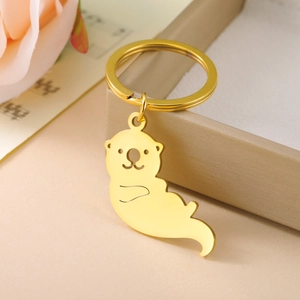 Porte-clés loutre dorée en acier inoxydable poli avec finition miroir brillante