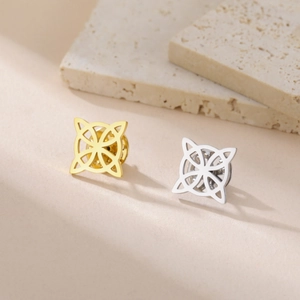 Detailed macro view of square celtic knot lapel pins in gold and silver finish