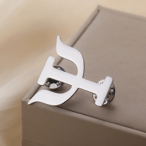 Detail view of silver 304 stainless steel Pi symbol brooch with dual butterfly pin backings