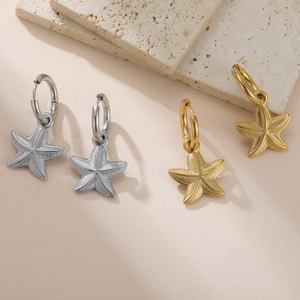 Starfish pendant hoop earrings in gold and silver finish with detailed texture
