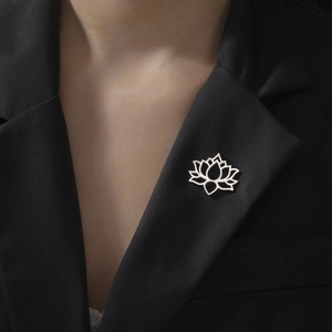 Elegant hollow lotus brooch in 304 stainless steel worn on a black formal suit lapel