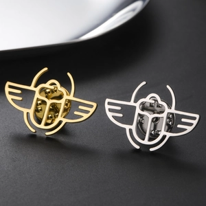Polished stainless steel scarab beetle brooches in gold and silver finish with pins