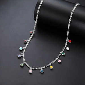 Detailed shot of silver steel chain with vibrant multi-colored round zircon pendants
