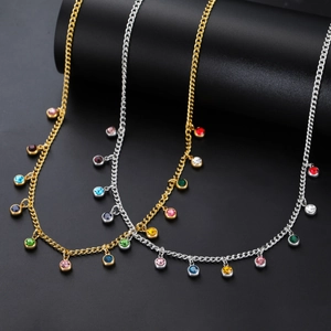 Detailed view of colorful round cubic zirconia pendants on gold and silver chain necklaces