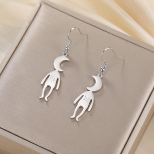 Macro shot of cute moon person dangle earrings made of 304 stainless steel with star motifs